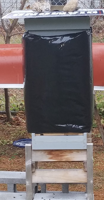 winter beehive prep includes setting the hive up to minimize drafts and provide added insulation